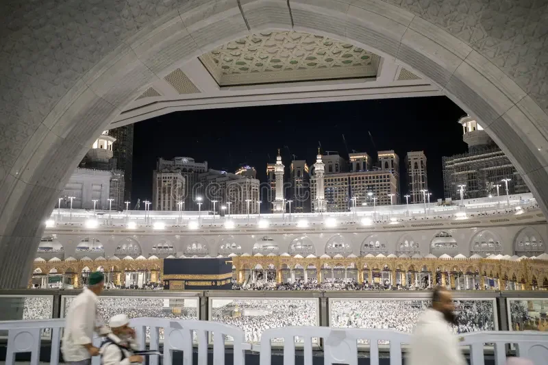 Home 54 Cheap Umrah packages UK 2026 with flights promotional image showing pilgrims around the Kaaba.